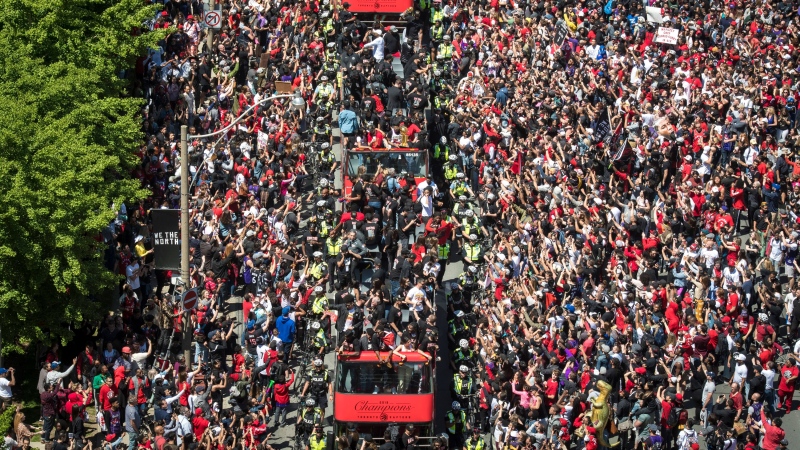 Fans flood the streets of Lake Shore Blvd. West to celebrate the Raptors during the Toronto Raptors NBA Championship Parade in Toronto on Monday, June 17, 2019. THE CANADIAN PRESS/Tijana Martin