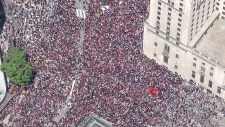 Aerial view of downtown Toronto packed with crowds