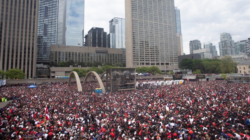 Crowds gather in Nathan Phillips Square as they prepare to celebrate the Toronto Raptors winning the NBA Championship in Toronto on Monday, June 17, 2019. THE CANADIAN PRESS/Chris Young