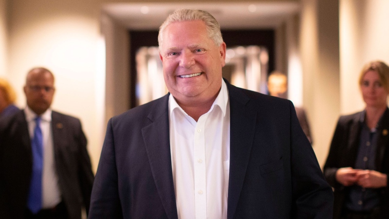 Ontario Premier Doug Ford walks into a holding room before speaking to journalists to share his achievements in government, in Toronto, on Friday June 7, 2019, on the one year anniversary of him taking office. THE CANADIAN PRESS/Chris Young