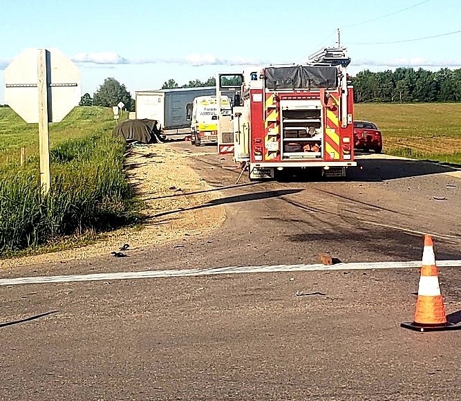 A collision between a SUV and transport truck kills three, child sent to hospital