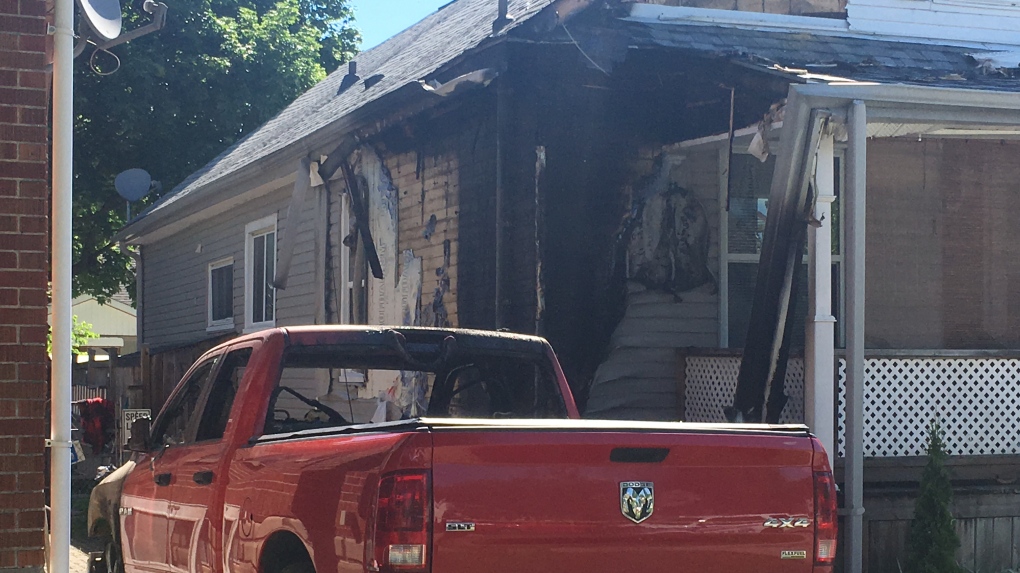 Truck fire damages home