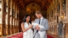 Prince Harry, Duke of Sussex (R), and his wife Meghan, Duchess of Sussex, pose with their newborn baby son, Archie Harrison Mountbatten-Windsor, in St George's Hall at Windsor Castle. (AFP)

