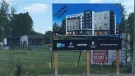 A sign shows plans for a new Holiday Inn Express in Lakeshore, Ont., on Wednesday, June 26, 2019. (Chris Campbell / CTV Windsor)