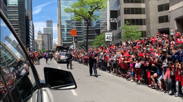 A crowd of people is seen along the route of the Raptors victory parade on June 17, 2019. 