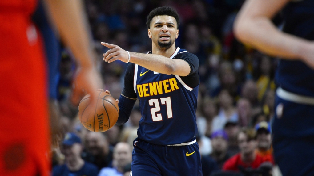 Denver Nuggets guard Jamal Murray directs his team
