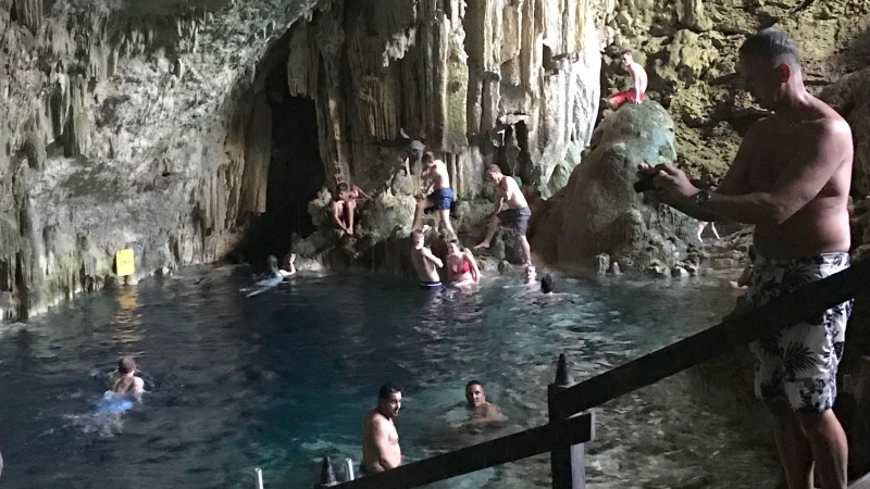 People tour a cave in Matanzas, Cuba in this undated photo. A Newfoundland woman is warning travellers to do their research before adventurous excursions abroad after she was hospitalized from a mysterious disease traced back to a cave she visited in Cuba.  (THE CANADIAN PRESS/HO, Terry Murphy)
