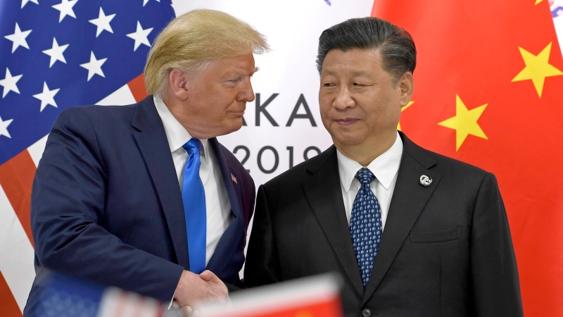 U.S. President Donald Trump, left, shakes hands with Chinese President Xi Jinping during a meeting on the sidelines of the G-20 summit in Osaka, Japan, Saturday, June 29, 2019. (AP Photo/Susan Walsh)