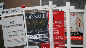 Real estate for sale signs are shown in Oakville, Ont. on Dec.1, 2018. THE CANADIAN PRESS/Richard Buchan
