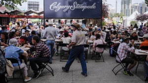 The first 25,000 visitors to the Calgary Stampede received tickets to a free pancake breakfast in Calgary on July 9, 2017. THE CANADIAN PRESS/Jeff McIntosh