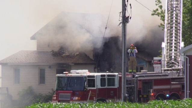 Fire crews work at the scene of a house fire near Auburn, Ont. on Friday, July 5, 2019. (Scott Miller / CTV London)