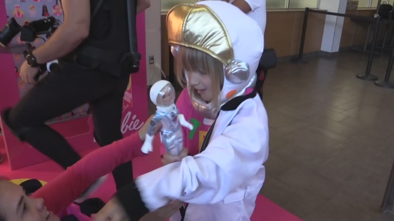 A STEM Camp attendee is outfitted as an astronaut, to match Astronaut Barbie, in London, Ont. on Friday, July 5, 2019. (Gerry Dewan / CTV London)