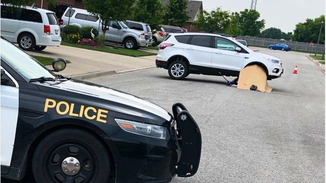 Ontario Provincial Police on the scene of an incident where a woman was run over by an SUV in the 300 block of Harvest Ln. on Saturday July 6, 2019. (Photo by AM800's Gord Bacon)