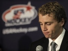 Chicago Blackhawks player Patrick Kane reads a statement to the media before the U.S. Olympic Men's Ice Hockey Orientation Camp in Woodridge, Il., Monday, Aug.17, 2009. (AP Photo/Paul Beaty)