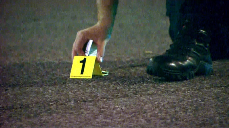 An evidence marker is seen at the scene of a shooting in the city's Oakwood Village on July 9, 2019. 