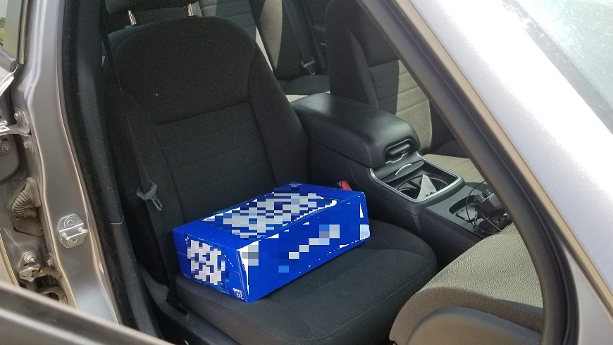 A case of beer allegedly used as a booster seat