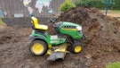 School staff found the John Deere abandoned the next morning with minor damage. (Saanich police)