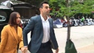 Jacob Hoggard arrives at court with his wife, Rebekah Asselstine, on July 12, 2019.