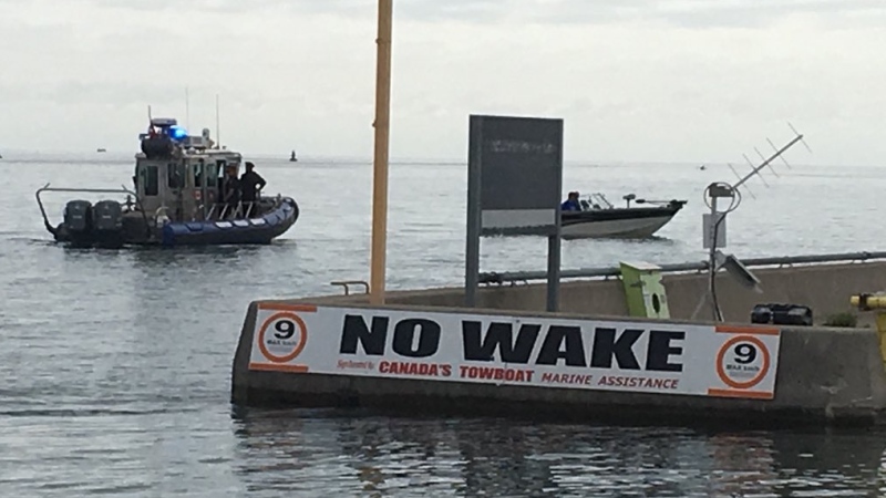A No Wake sign is visible along the shoreline in Windsor, Ont., on Friday, July 12, 2019. (Chris Campbell / CTV Windsor)