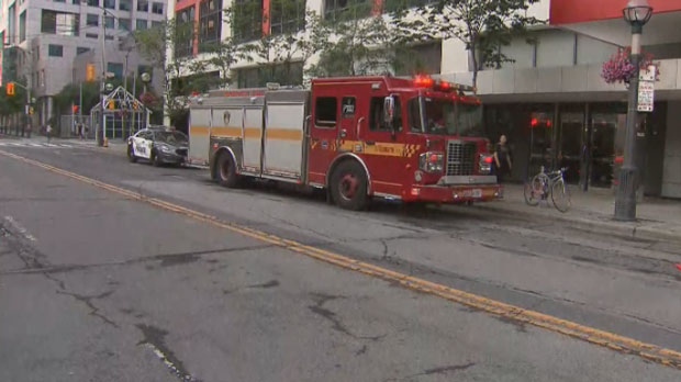 Emergency crews respond to reports of a man falling into the elevator shaft of a building near John and Front streets on July 13, 2019.