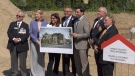 Federal Minister of Seniors Filomena Tassi, third from left, and other officials unveil plans for a new housing complex for seniors and veterans in London, Ont. on Monday, July 15, 2019. (Marek Sutherland / CTV London)
