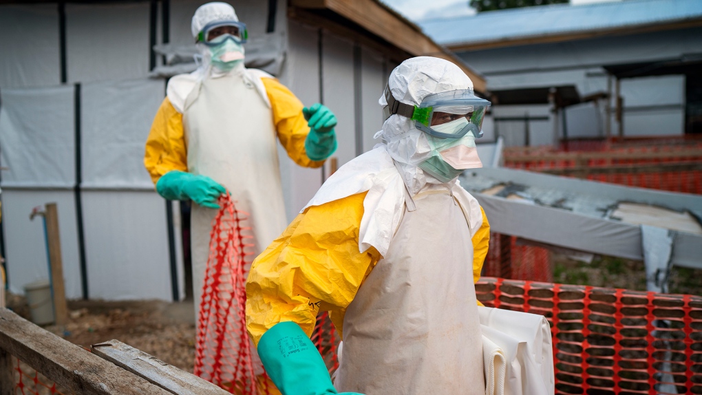 Health workers wearing protective suits in DRC