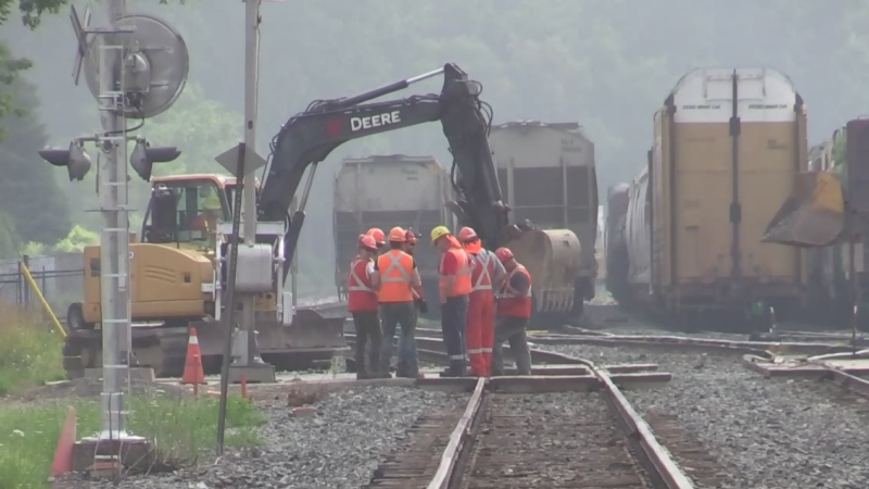 Work is done on pavement repairs at the CP Rail tracks on Adelaide Street near Oxford Street in London, Ont. on Thursday, July 18, 2019. (Gerry Dewan / CTV London)