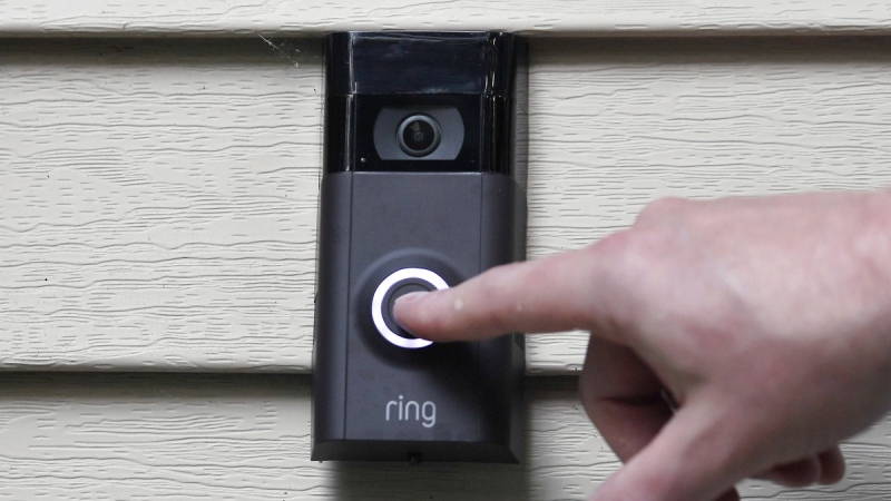 Ernie Field pushes the doorbell on his Ring doorbell camera at his home in Wolcott, Conn., on July 16, 2019. (Jessica Hill / AP)