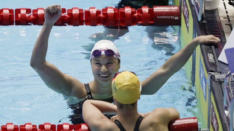 London's Margaret MacNeil reacts after winning the women's 100m butterfly final at the World Swimming Championships in Gwangju, South Korea, Monday, July 22, 2019. (AP Photo/Mark Schiefelbein)