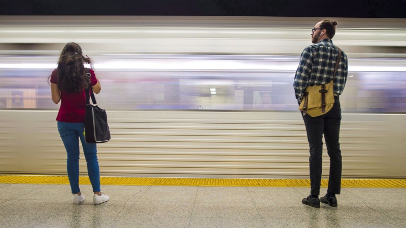 Commuters wait to take the subway in Toronto on Friday, June 22, 2018. (The Canadian Press / Tijana Martin)