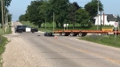 A motorcycle and a flatbed truck were involved in a crash northeast of Aylmer on Tuesday, July 23, 2019. (Sean Irvine / CTV London)
