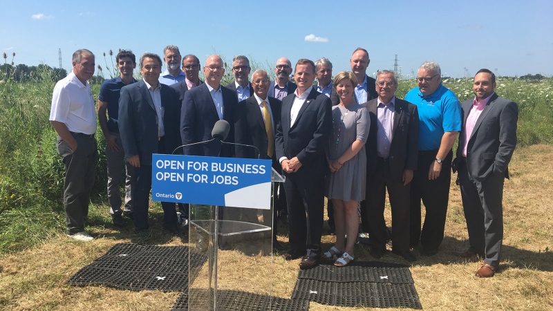 Government officials and business leaders gather to announced Element5's new timber plant in St. Thomas, Ont. on Tuesday, July 23, 2019. (Brent Lale / CTV London)