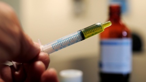 In this Nov. 6, 2017 file photo, a syringe with a dose of CBD oil is shown in a research laboratory in Fort Collins, Colo. CBD is a compound found in marijuana but doesn’t cause a high. On Tuesday, July 23, 2019, the Food and Drug Administration announced it has warned Curaleaf Inc., of Wakefield, Mass., for illegally selling unapproved CBD products. (AP Photo/David Zalubowski, File)