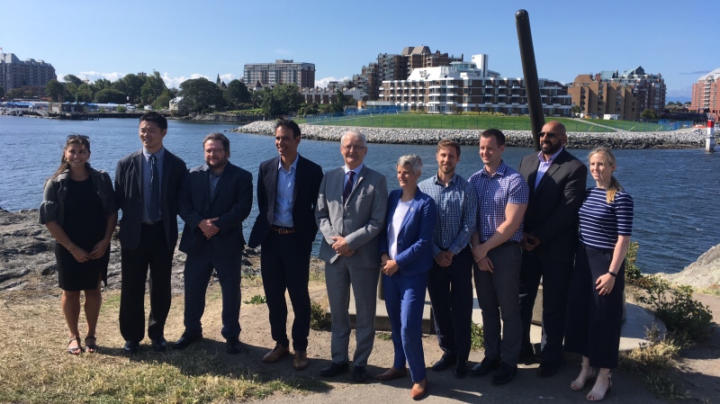 Minister of Transport Marc Garneau and Victoria Mayor Lisa Helps announce the completion of the Middle Harbour Remediation Project on July 24, 2019. (CTV Vancouver Island)  