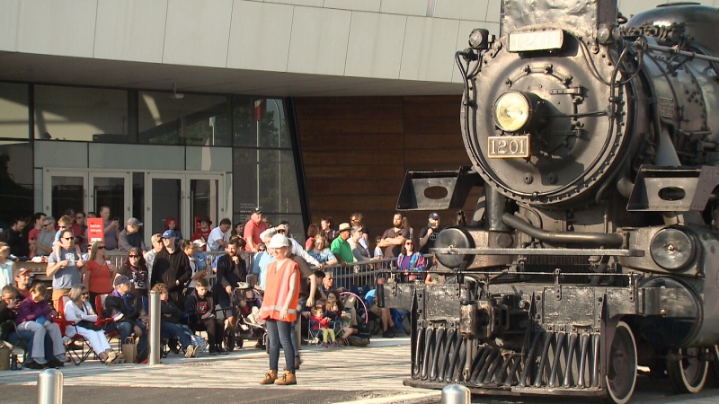 Public watching the CP 1201 hit the tracks. 