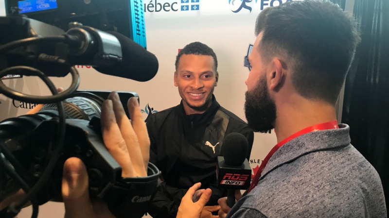 Andre De Grasse smiles during an interview in Montreal on July 25, 2019.