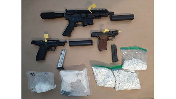 Guns and drugs seized in a raid in Ajax are seen in this police handout. (Durham Regional Police)