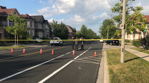Police are seen on Castlemore Avenue in Markham after four people were found dead in a home on the afternoon of July 28, 2019. (Brandon Rowe/CTV News Toronto)