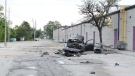 A burned-out BMW car is seen in a Windsor parking lot after a crash on July 28, 2019. (Courtesy Windsor Police Service)