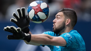 Vancouver Whitecaps goalkeeper Maxime Crepeau reaches for the ball as it goes wide of the goal during the first half of an MLS soccer game against the Philadelphia Union in Vancouver on April 27, 2019. (Darryl Dyck / THE CANADIAN PRESS)