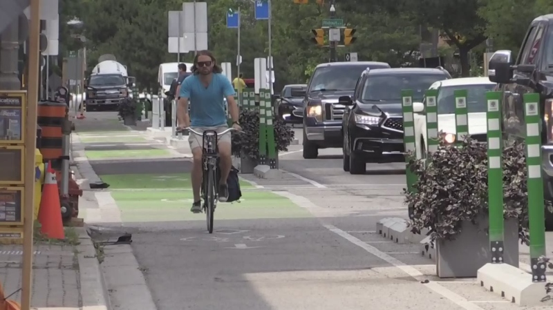 Cycling advocate Daniel Hall of London Cycle Link rides in the bike lanes on King Street in London, Ont. on Wednesday, July 31, 2019. (Daryl Newcombe / CTV London)