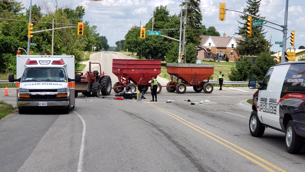 A motorcycle and tractor crash 