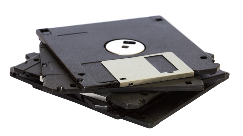Four black floppy discs on white surface (Pexels)