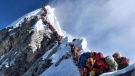 In this photo made on May 22, 2019, a long queue of mountain climbers line a path on Mount Everest. (Nirmal Purja/@Nimsdai Project Possible via AP) 