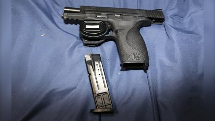 A handgun seized from a residence in Lakeshore, Ont. is seen in this image provided by Essex County OPP.