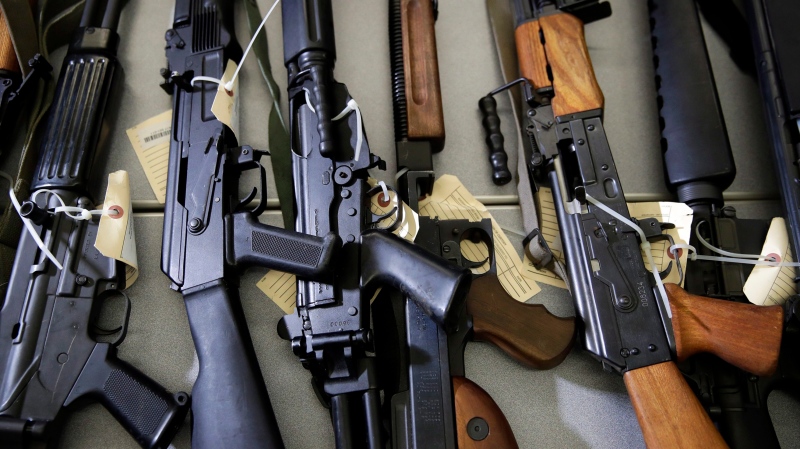 In this Oct. 9, 2018, file photo, Illegally possessed firearms seized by authorities are displayed at a news conference in Los Angeles. (AP Photo/Jae C. Hong, File)