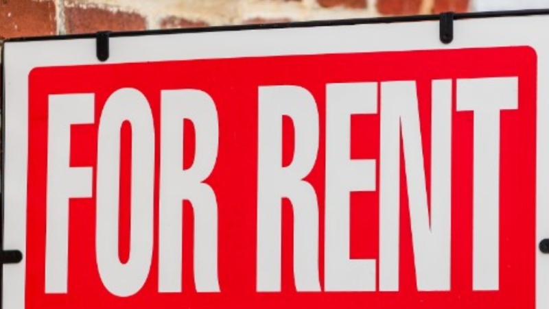 A sign advertising a rental unit. (Shutterstock)