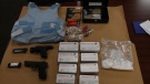Weapons, drugs and cash seized in London, Ont. on Wednesday, Aug. 21, 2019 are seen in this image released by the London Police Service.