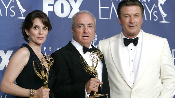 Tina Fey, executive producer Lorne Michaels and Alec Baldwin pose with the award for outstanding comedy series for their work on '30 Rock' at the 59th Primetime Emmy Awards. (AP / Reed Saxon)