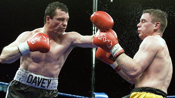 Former boxing world champion Dave Hilton Jr. lands a left onto Adam Green Tuesday, May 1, 2007 in Montreal. (Paul Chiasson / THE CANADIAN PRESS)
